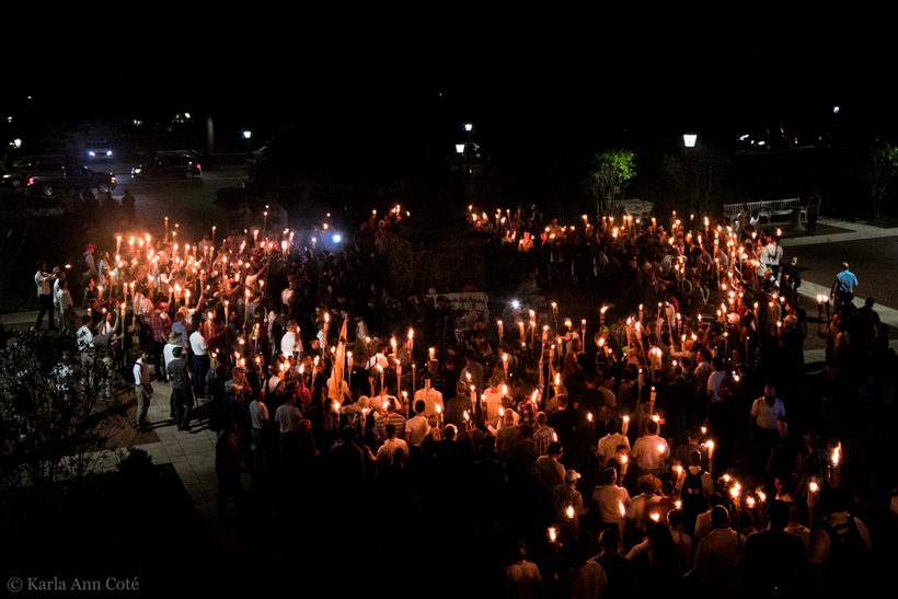 <em>Hundreds of white supremacists gather at a rally in Charlottesville to protest the removal of a confederate statue. Photo