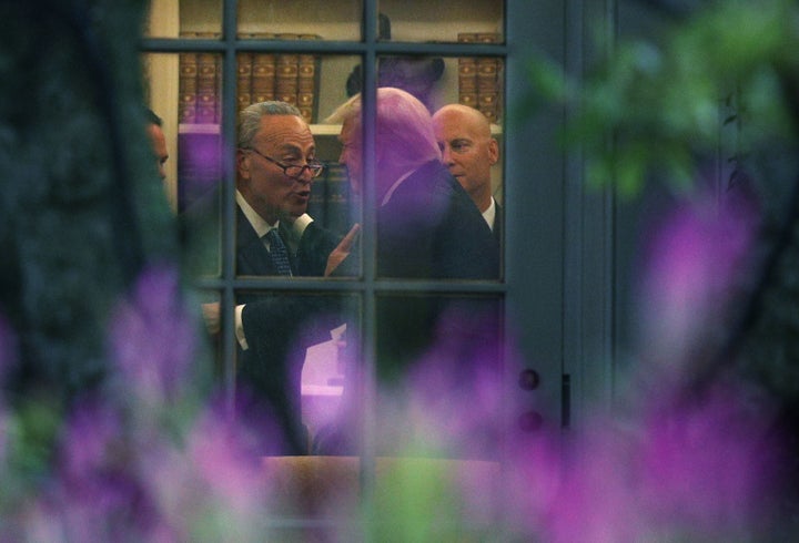 Senate Minority Leader Chuck Schumer (D-N.Y.) makes a point to President Donald Trump in the Oval Office on Wednesday.&n