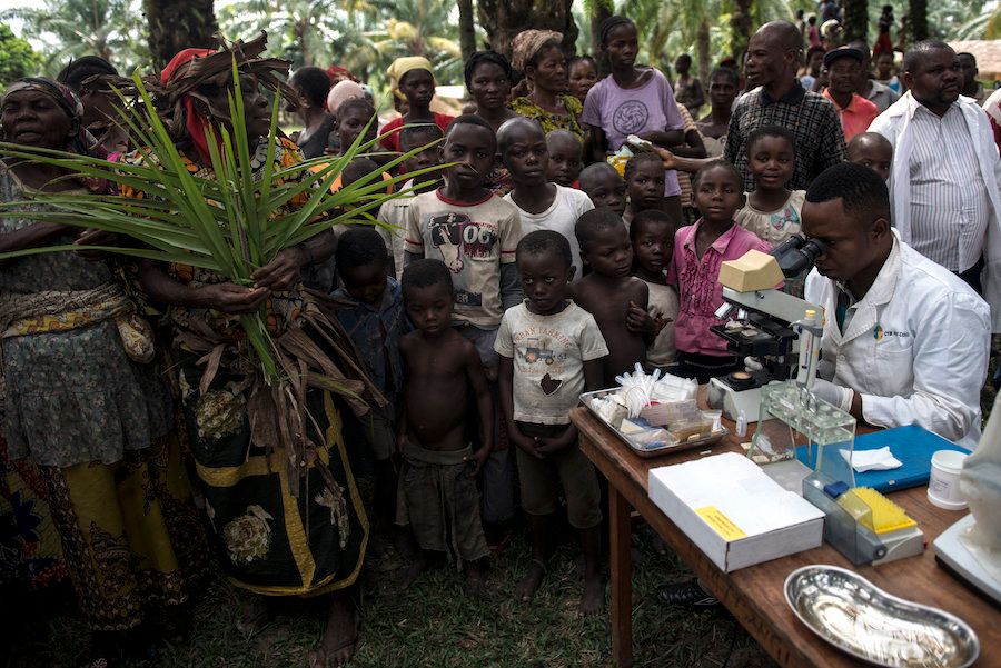 Doctors test for sleeping sickness in a remote Congolese village.