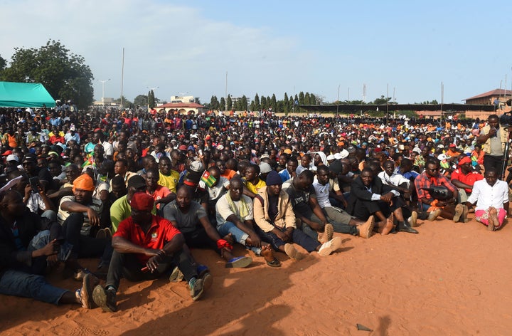 Supporters listen as opposition party leaders speaks during an anti-government rally in Lome on September 6, 2017. 