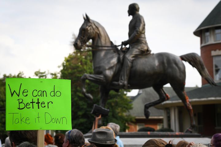Protesters gather below a monument dedicated to Confederate Maj. John B. Castleman while demanding that it be removed from the public square in Louisville, Kentucky, on Aug. 14, 2017.