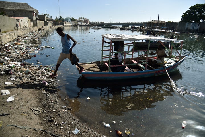 A man jump fron a boat in Mapou River in Cap-Haitien, Haiti, on September 6, 2017. Inhabitants of Shada, a poor riverside community in Cap-Haitien, were surprised to learn that a massive, potentially catastrophic hurricane was headed their way.