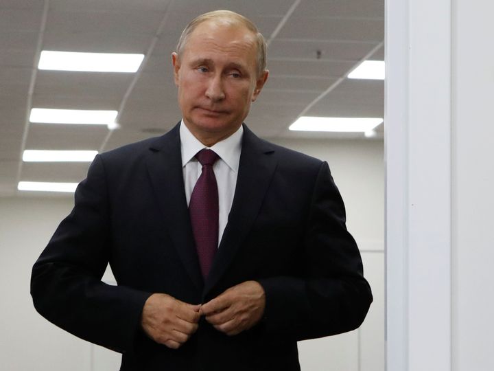 Putin enters a hall before a meeting with Japanese Prime Minister Shinzo Abe at the Eastern Economic Forum in Vladivostok, Russia, 7 September.