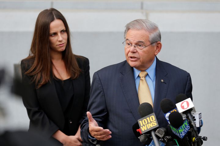 Sen. Bob Menendez speaks to journalists on Tuesday outside United States District Court for the District of New Jersey in Newark, New Jersey, after arriving to face trial for federal corruption charges. His daughter Alicia Menendez looks on.