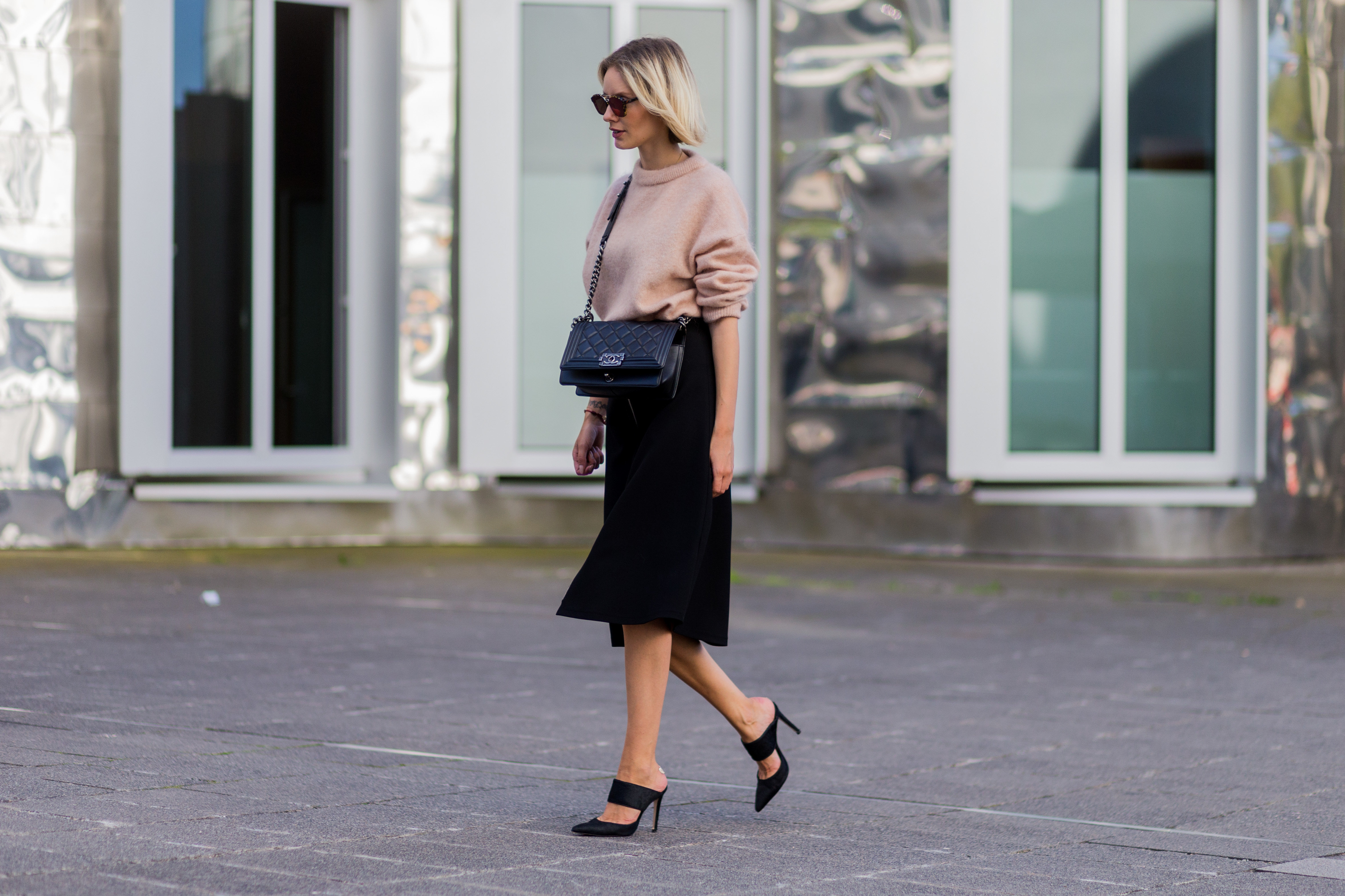 pleated midi skirt and trainers