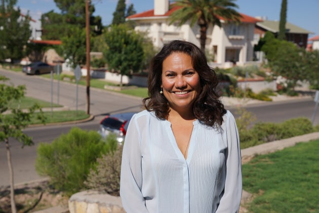 Veronica Escobar, 47, stands in her front yard in El Paso, Texas. She is hoping to be the first Latina...