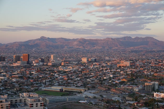 Just beyond the tall buildings of downtown El Paso, Texas, is Ju&aacute;rez Mexico and the Sierra Madre...