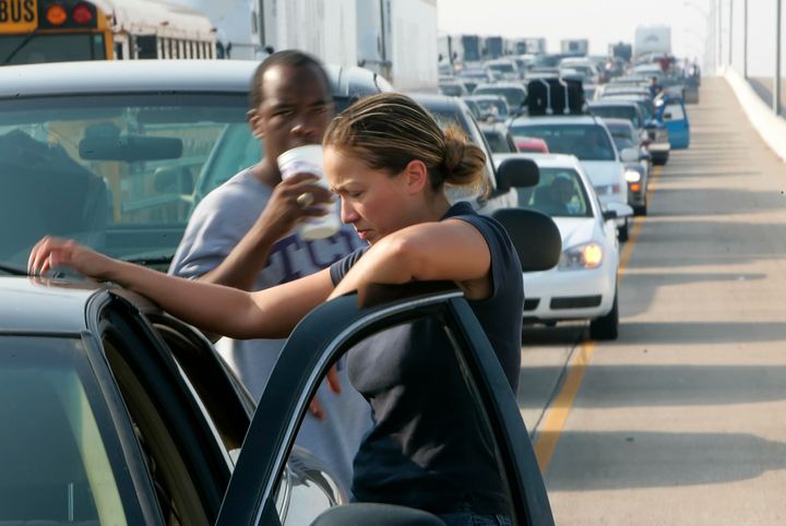 Martha Velazquez stands on the road in stalled traffic in eastern Houston as people try to evacuate in advance of Hurricane Rita on Sept. 22, 2005.