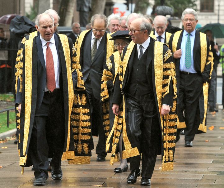 Lord Neuberger (left) walks towards Westminster Abbey with Deputy President Lord David Hope (right), after being sworn in as the new President of the Supreme Court in the courts main chamber, in Westminster, central London.