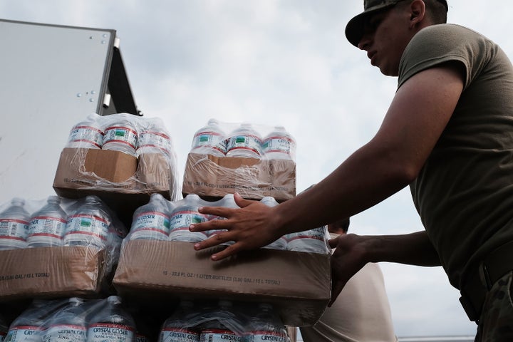 Members of the Texas National Guard prepare to distribute water and emergency meals as Texas slowly moves toward recovery from the devastation of Hurricane Harvey.