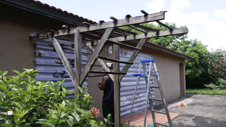 Metal shutters are installed on the home of Juana Cubillas in Country Walk, Florida.