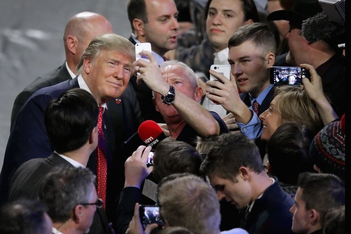 Then-Republican presidential candidate Donald Trump posed for selfies with supporters after speaking at Liberty University, a Christian institution, in January 2016.