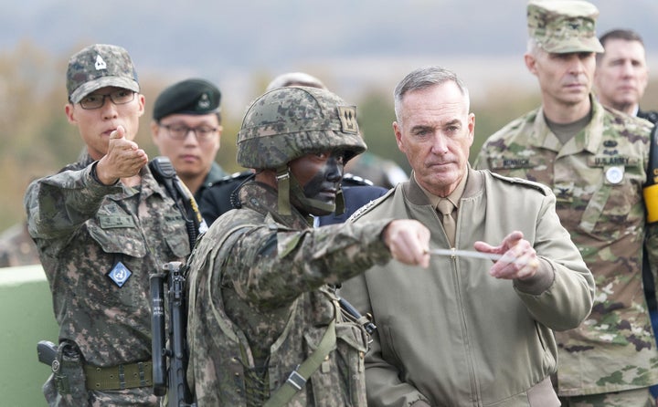 Gen. Joseph F. Dunford, Chairman of the Joint Chiefs of Staff, being briefed by U.S. Army Col. James Minnich, during a visit to the Korean Demilitarized Zone.