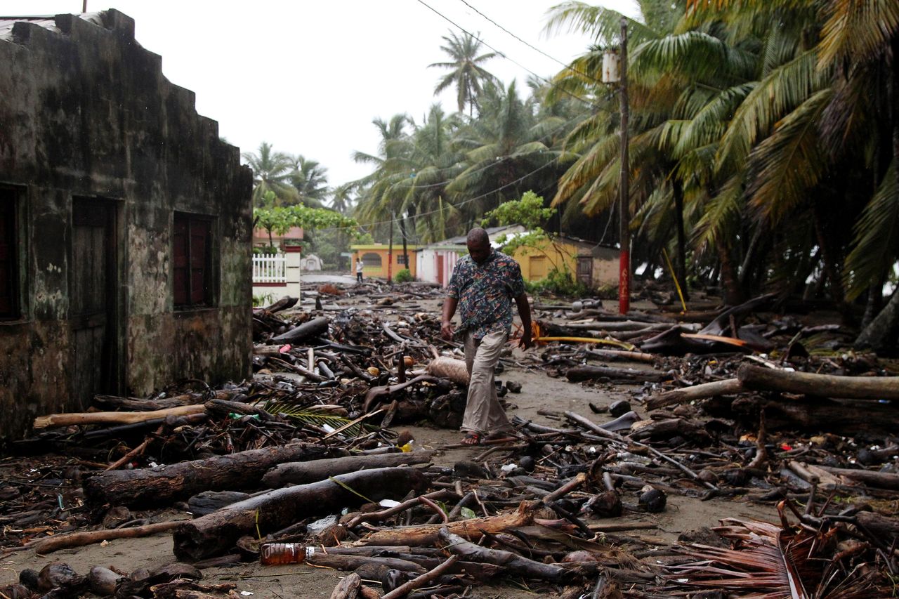 A man in the Dominican Republic surveys the devastation wreaked by the storm 