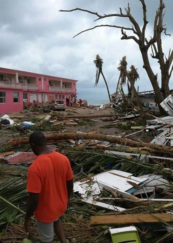 A man surveys the devastation left by the storm 