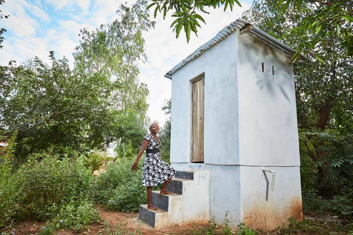 Jennifer stands on the steps of her eco-toilet, next to her house, Luchenza, southern Malawi, 2017. The Children’s Fund of Malawi, the charity that runs Green Malata, has also installed eco-toilets next to the houses of several of its students. Waste is collected in the bottom of the toilets, and is later added to a biogas facility which now provides all the power for the entrepreneurial training village where she studies how to make solar panels. 