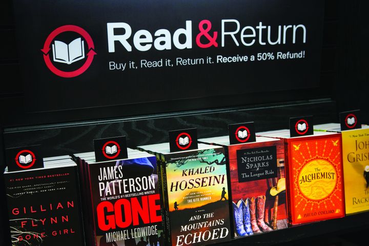A Read & Return sign at an airport bookstore