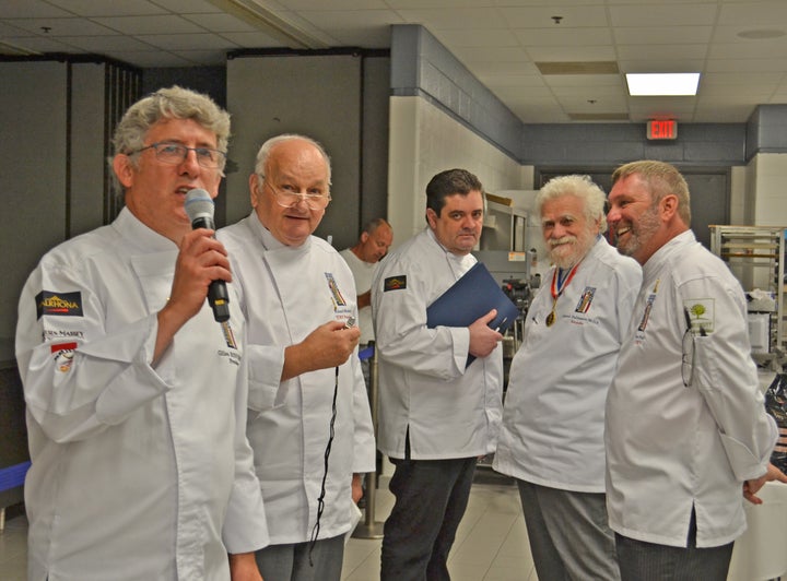 <p>Judges Sylvain Leroy (center), Gabriel Paillasson MOF, and Roy Pell watch as Club Coupe du Monde President Gilles Renusson (far left) counts down the last seconds of the trials and judge Roland Mesnier prepares to blow the whistle </p>