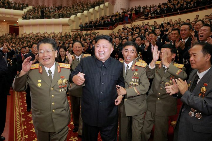 North Korean leader Kim Jong Un reacts during a celebration for nuclear scientists and engineers who contributed to a hydrogen bomb test, in this undated photo released by North Korea's Korean Central News Agency 