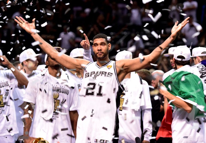 Tim Duncan celebrates the last of his five NBA championships in 2014.