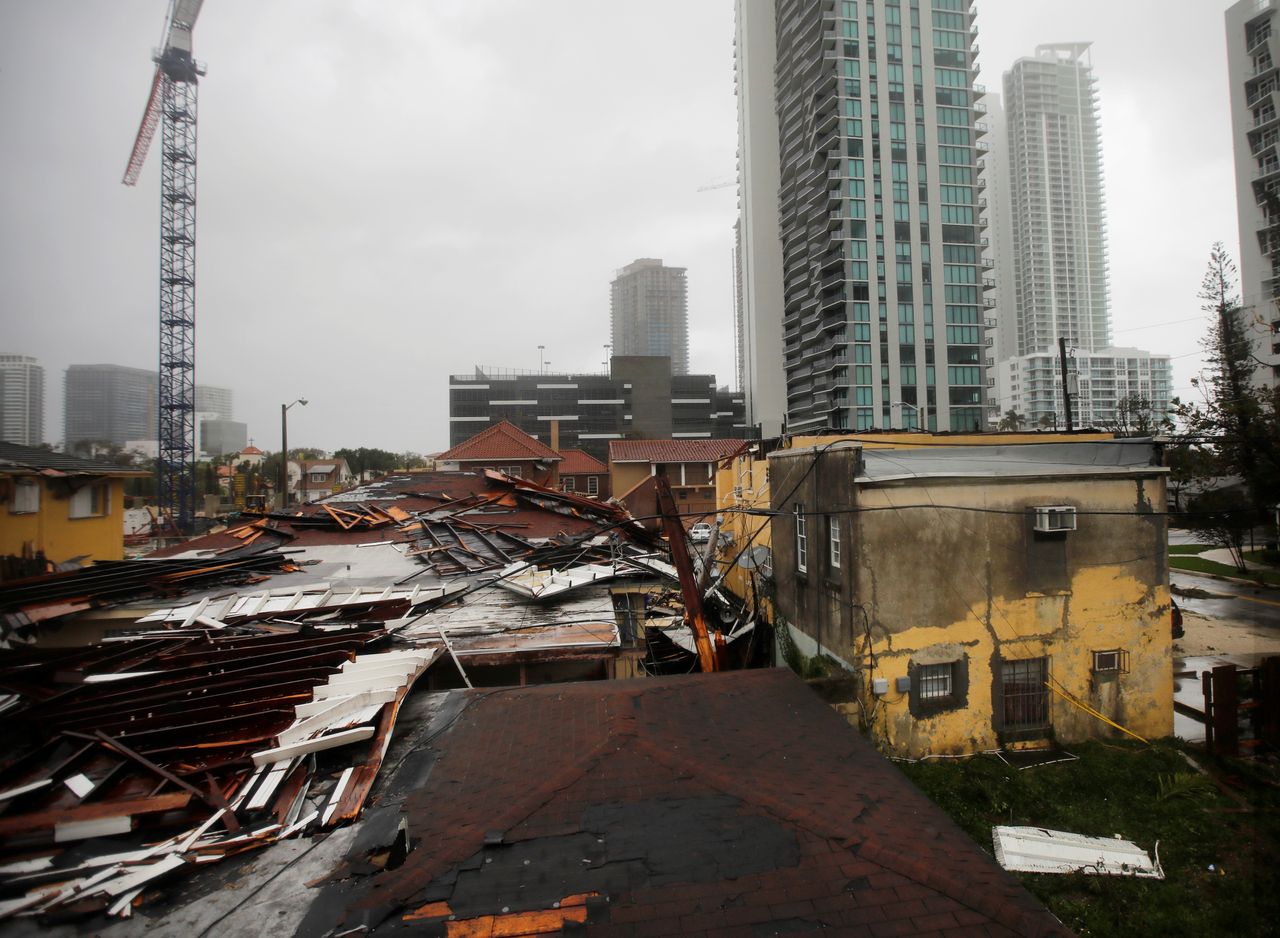 Destroyed roofs at a residential areas are seen as Hurricane Irma passes Miami.