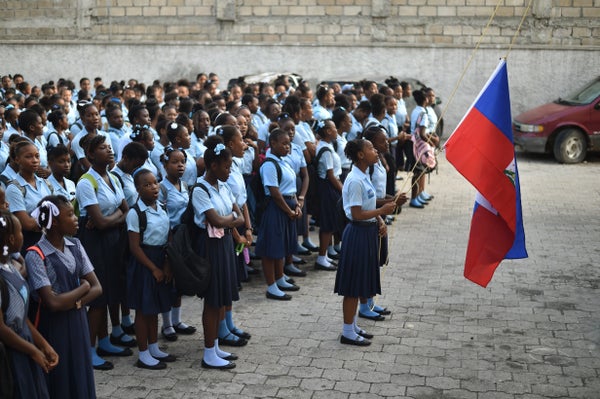 Students prepare for the first day of school at the Lycee du Cent Cinquantatenaire, in Port-au-Prince.