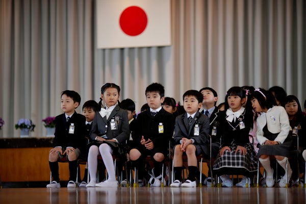 Children attend a ceremony on their first day of school at Shimizu elementary school in Fukushima, Japan.