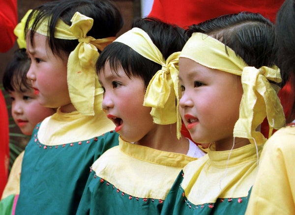 Young Vietnamese children are dressed up and ready to perform for parents and local officials on the first day of the school 