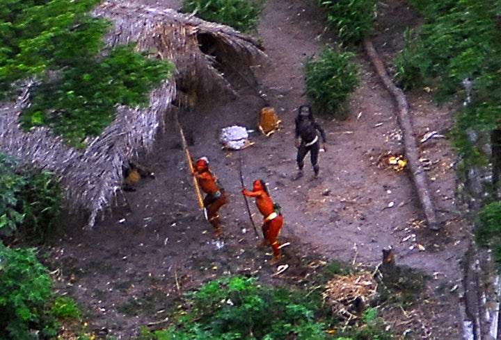 Members of an uncontacted tribe in Brazil's Amazon Basin were photographed by air in 2008. At least 10 members of a tribe in this region were reportedly killed by gold miners last month.