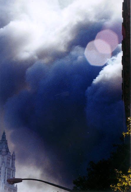 After both buildings fell on 9-11-01, And the wind began to blow the dark dust... two large orbs appear in this photograph. 