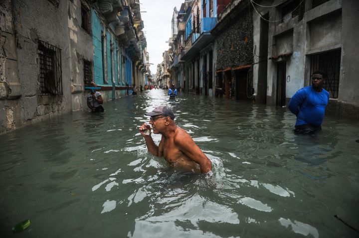 A Cuban wades through a flooded street in Havana, on September 10, 2017.