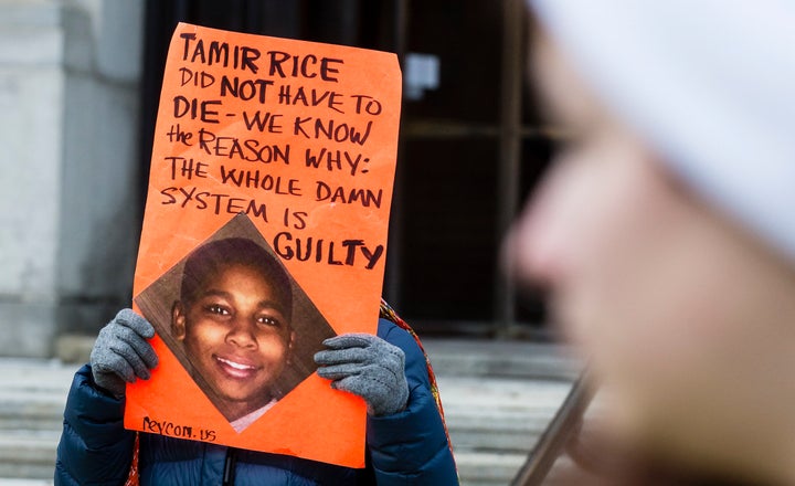 An unidentified woman protests the death of 12-year-old Tamir Rice in Cleveland.