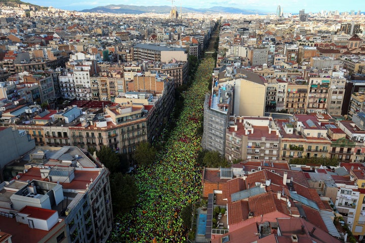Thousands of participants wear green t-shirts provided by the National Catalan Assembly (ANC) during a rally on Catalonia's n