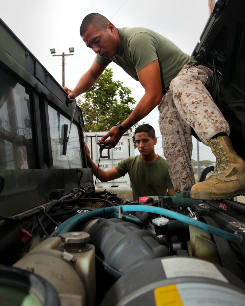 Marines with the 15th Marine Expeditionary Unit at Camp Pendleton conduct preventative maintenance weekly on tactical vehicle