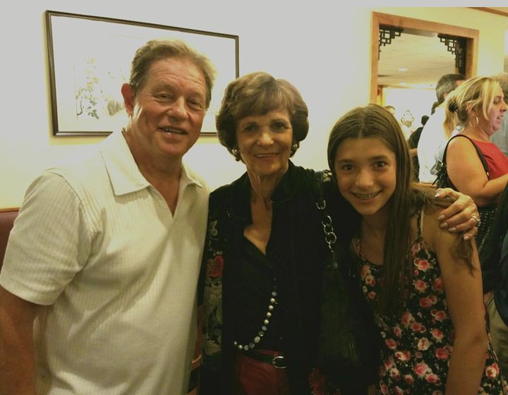 <p>Jimmy Tingle with Kitty Dukakis and Dukakis granddaughter Nora</p>