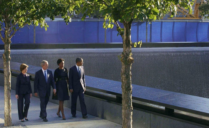 President Barack and First Lady Michelle Obama, accompanied by former President George W. and former First Lady Laura Bush, at the opening of the National September 11 Memorial and Museum on Sept. 11, 2011.