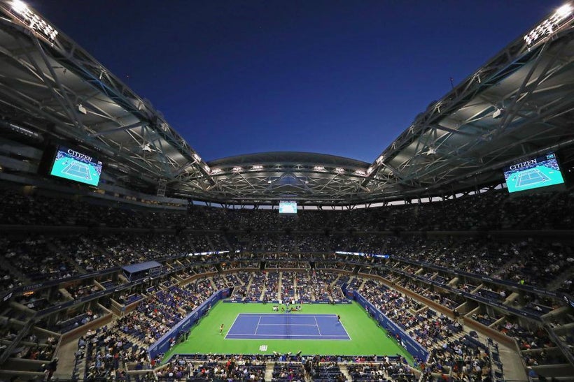 The <a rel="nofollow" href="https://usopen.io-media.com/" target="_blank">Arthur Ashe Stadium</a>, at the <a rel="nofollow" h