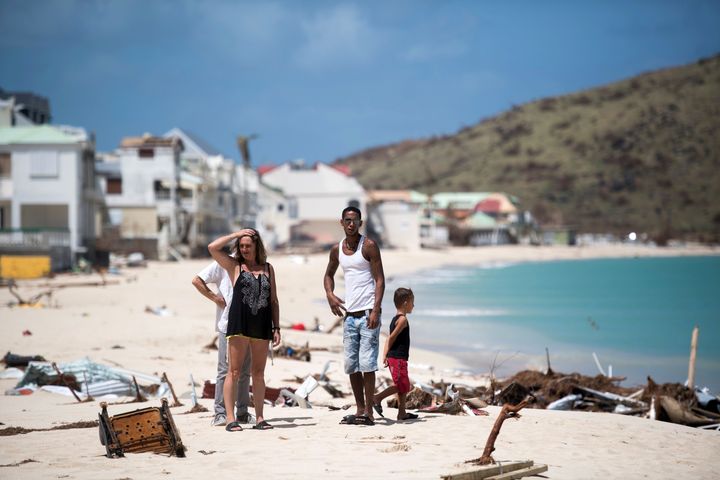 People inspect the damage on the island of Saint-Martin after the hurricane