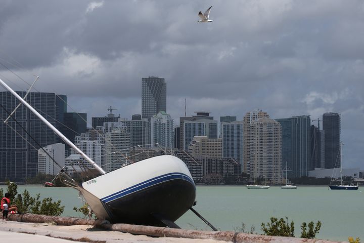 The Miami skyline is seen above a boat that went ashore after the passing of Hurricane Irma.