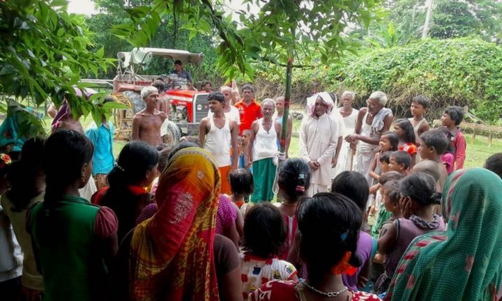 Villagers celebrate India’s Independence Day three days after August’s flash flood.