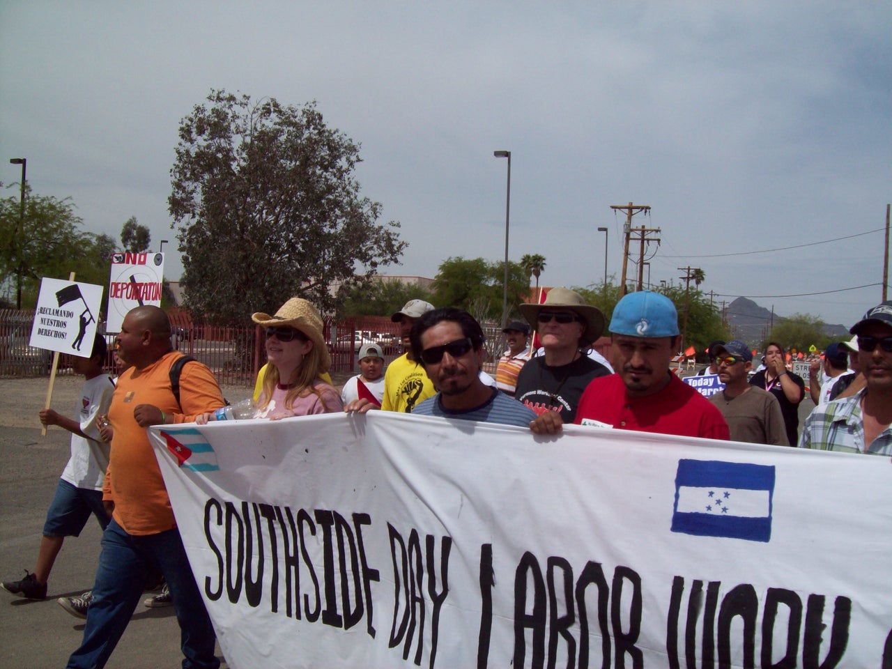 Rev. Alison Harrington (left, in pink) demonstrating with members with members of the Southside Worker Center against Arizona’s anti-immigrant bill SB1070 in 2010.