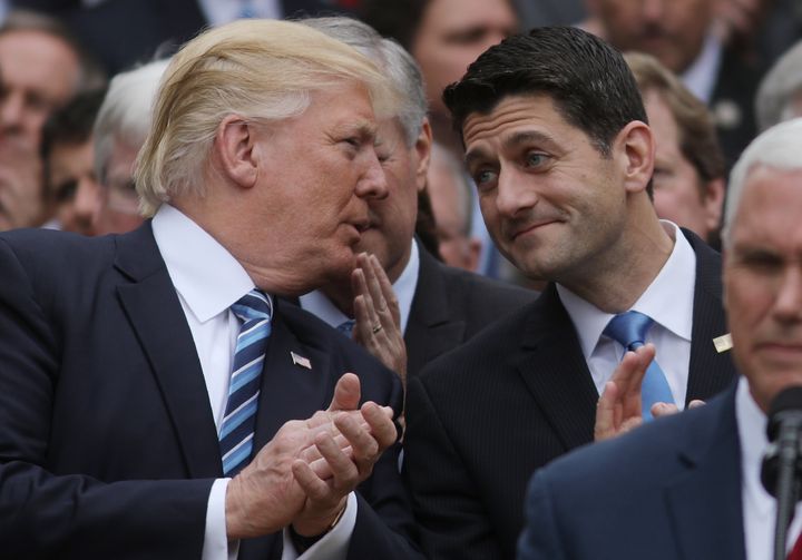 President Donald Trump chats with House Speaker Paul Ryan at a gathering of congressional Republicans in the White House Rose Garden in May.