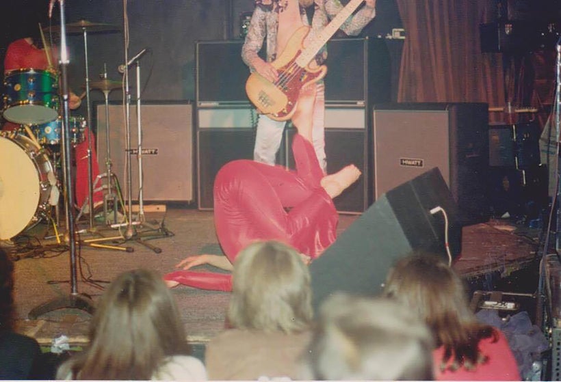 <em>Janita Haan upside down mid-performance</em>