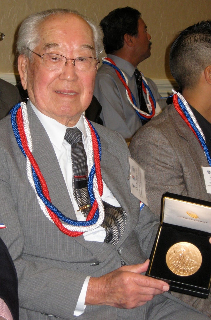 <p>Ray Mayeda in 2011 holding the Congressional Gold Medal awarded to his brother Al for serving in U.S. Army during WWII</p>