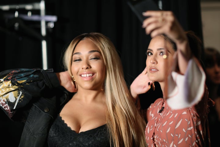 Jordyn Woods prepares backstage.