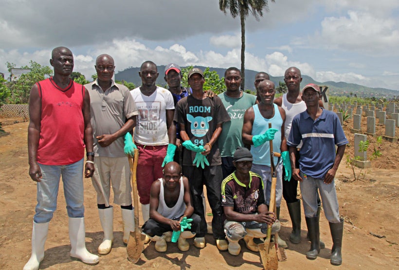 Ebola burial teams return to Waterloo cemetery to help with the graves of the hundreds of people lost in the recent mudslides