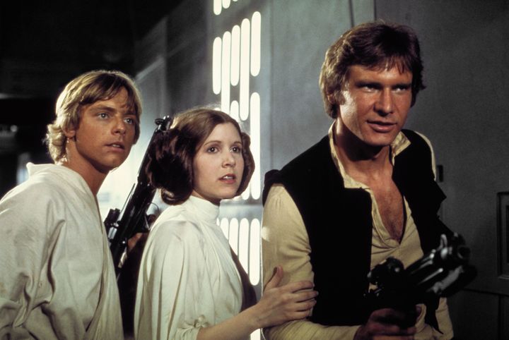 Mark Hamill, Carrie and Harrison as Luke Skywalker, Princess Leia and Han Solo in 'A New Hope' 