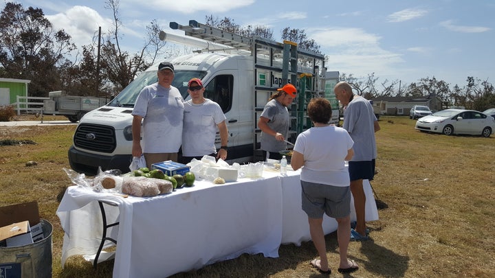 Volunteers help serve food in Goodland, Florida.