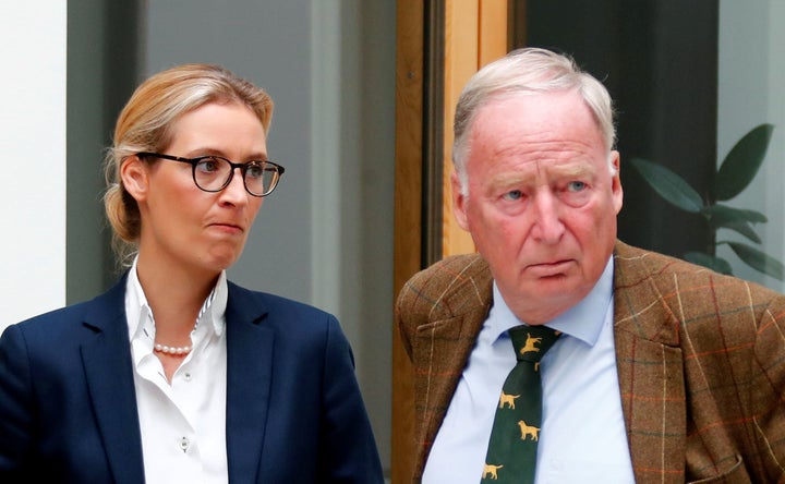 Alice Weidel (L) and Alexander Gauland of the anti-immigration party Alternative for Germany (AFD) react before they address