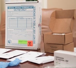 Sexual Assault Evidence Kit including swaps, fingernail scrapings kit, clothing bag, and other tools.